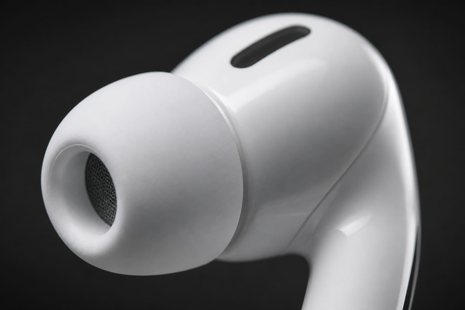 Close-up of AirPods Pro 3 ear tips and charging case